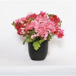 Artificial pink flowers and pot